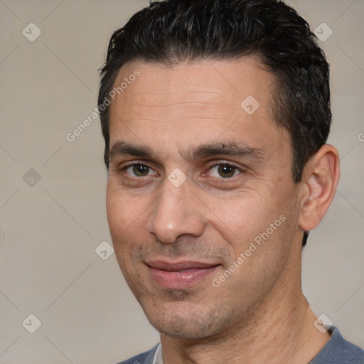 Joyful white adult male with short  brown hair and brown eyes