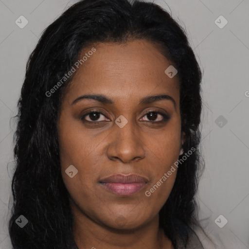 Joyful black young-adult female with long  brown hair and brown eyes