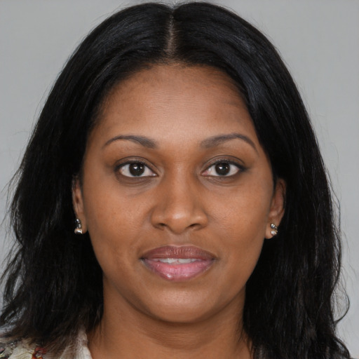 Joyful black young-adult female with medium  black hair and brown eyes