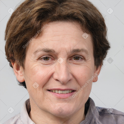 Joyful white adult female with short  brown hair and brown eyes