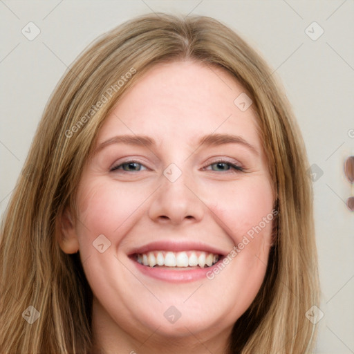 Joyful white young-adult female with long  brown hair and blue eyes