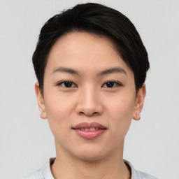 Joyful asian young-adult female with short  black hair and brown eyes