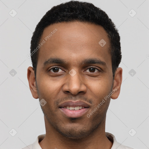 Joyful black young-adult male with short  black hair and brown eyes