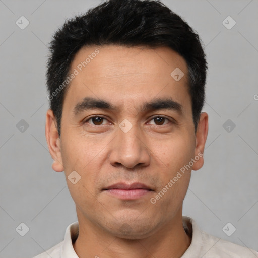 Joyful white young-adult male with short  black hair and brown eyes