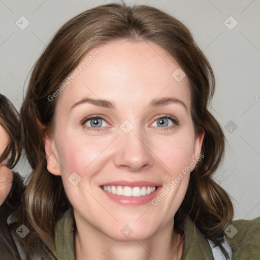 Joyful white young-adult female with medium  brown hair and blue eyes