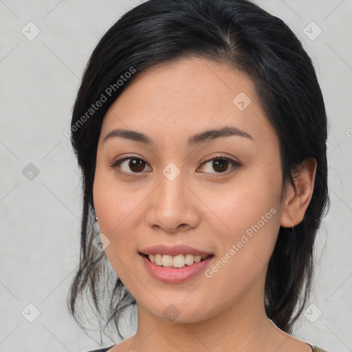 Joyful asian young-adult female with medium  brown hair and brown eyes