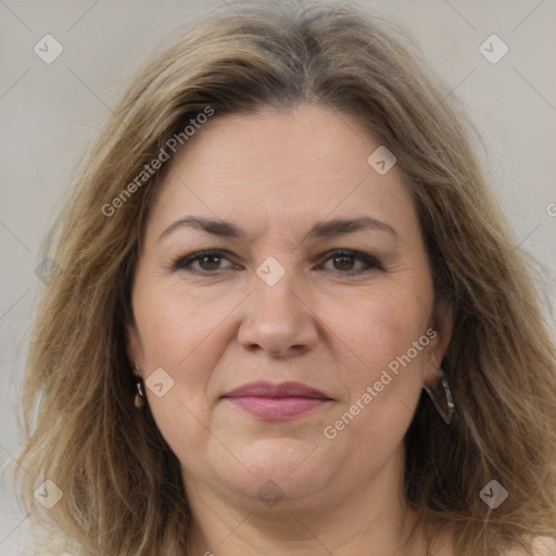 Joyful white adult female with medium  brown hair and brown eyes