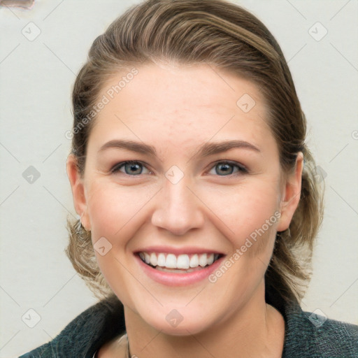 Joyful white young-adult female with medium  brown hair and blue eyes