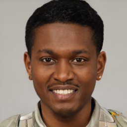 Joyful latino young-adult male with short  brown hair and brown eyes