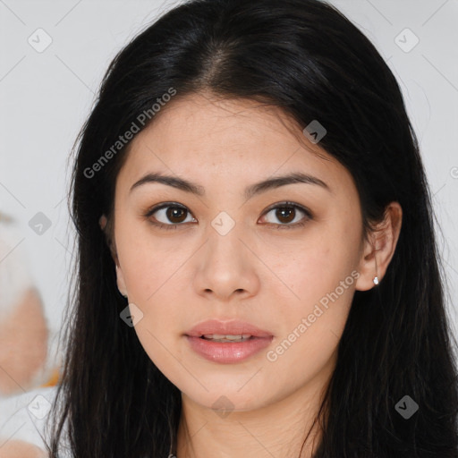 Joyful asian young-adult female with long  brown hair and brown eyes