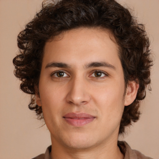 Joyful white young-adult male with medium  brown hair and brown eyes