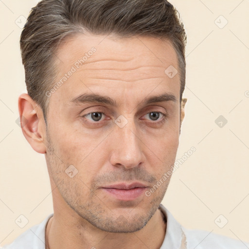 Neutral white adult male with short  brown hair and brown eyes