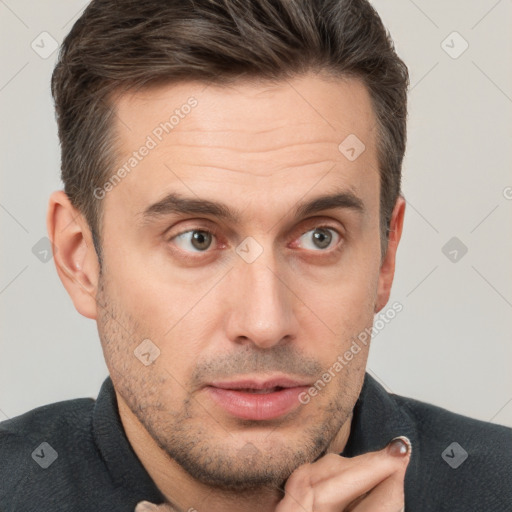 Joyful white adult male with short  brown hair and brown eyes