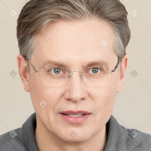 Joyful white adult male with short  brown hair and grey eyes