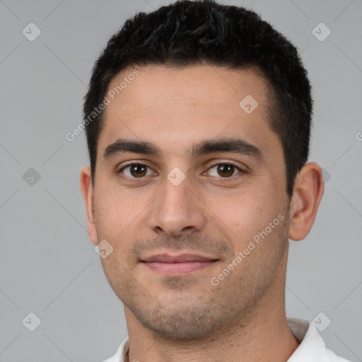 Joyful white young-adult male with short  brown hair and brown eyes