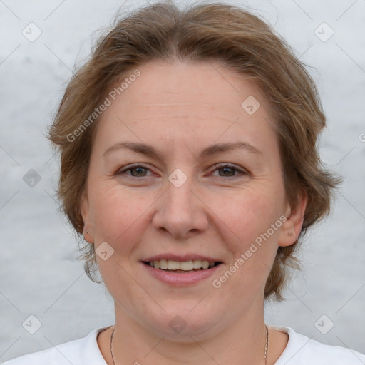 Joyful white adult female with medium  brown hair and blue eyes