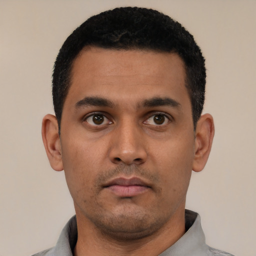 Neutral latino young-adult male with short  black hair and brown eyes