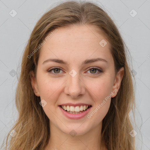 Joyful white young-adult female with long  brown hair and green eyes