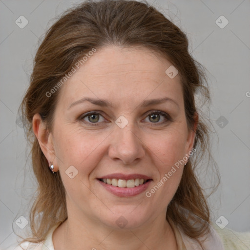 Joyful white adult female with medium  brown hair and grey eyes