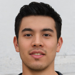 Joyful asian young-adult male with short  black hair and brown eyes