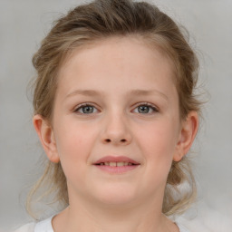 Joyful white child female with medium  brown hair and grey eyes