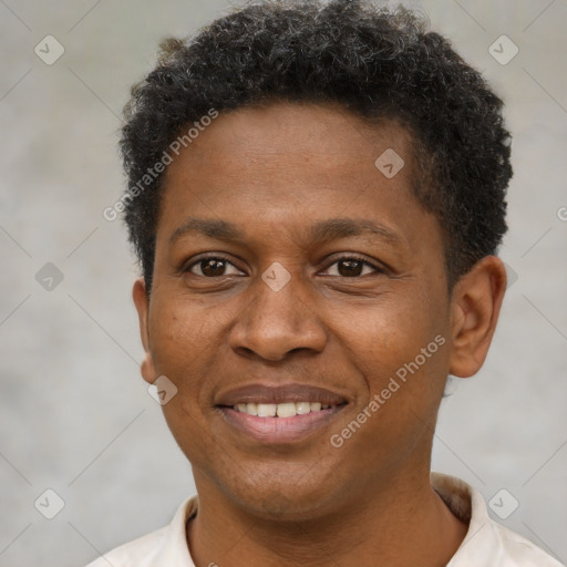 Joyful latino young-adult male with short  brown hair and brown eyes