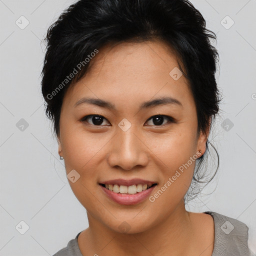 Joyful asian young-adult female with short  brown hair and brown eyes