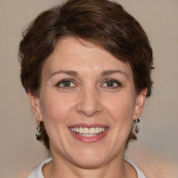 Joyful white adult female with short  brown hair and brown eyes