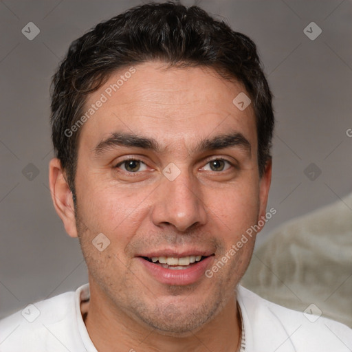 Joyful white adult male with short  brown hair and brown eyes