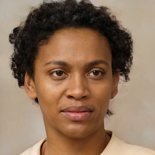 Neutral black young-adult female with short  brown hair and brown eyes