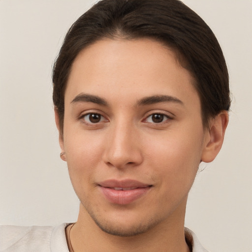 Joyful white young-adult female with short  brown hair and brown eyes