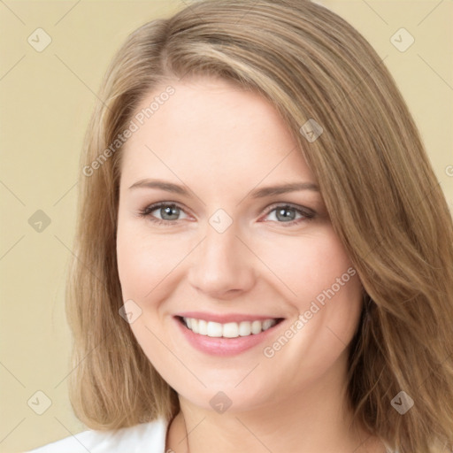 Joyful white young-adult female with long  brown hair and green eyes