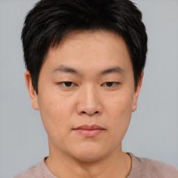 Neutral asian young-adult male with short  brown hair and brown eyes