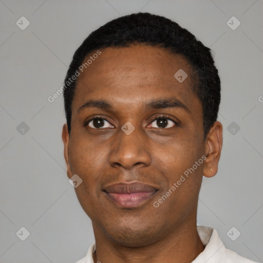 Joyful black young-adult male with short  black hair and brown eyes