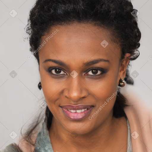 Joyful black young-adult female with long  brown hair and brown eyes