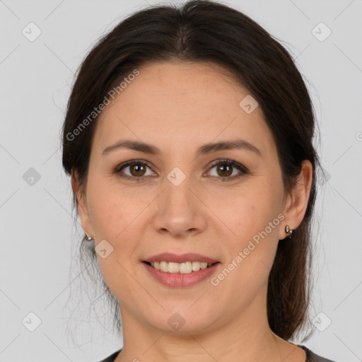 Joyful white adult female with medium  brown hair and brown eyes