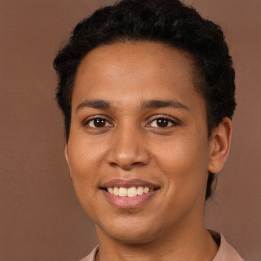 Joyful latino young-adult female with short  brown hair and brown eyes