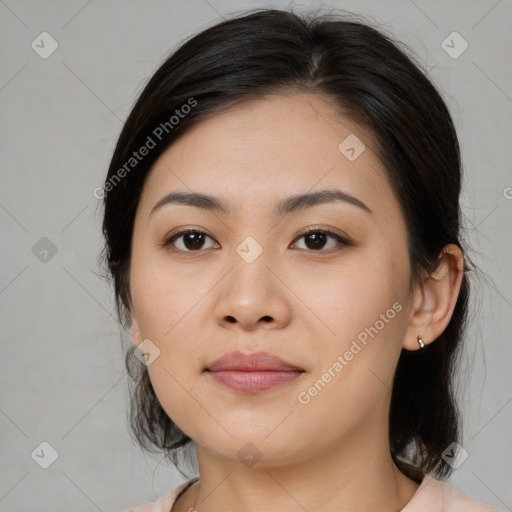 Joyful asian young-adult female with medium  brown hair and brown eyes