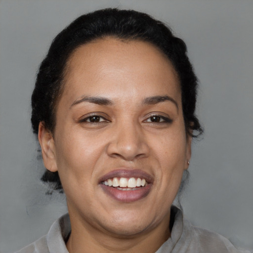 Joyful latino young-adult female with short  brown hair and brown eyes