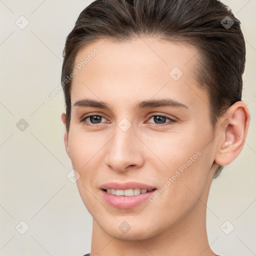 Joyful white young-adult female with short  brown hair and brown eyes