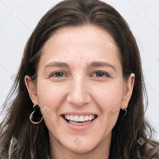 Joyful white young-adult female with long  brown hair and grey eyes