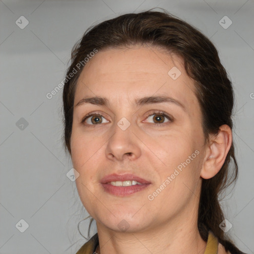 Joyful white adult female with medium  brown hair and brown eyes