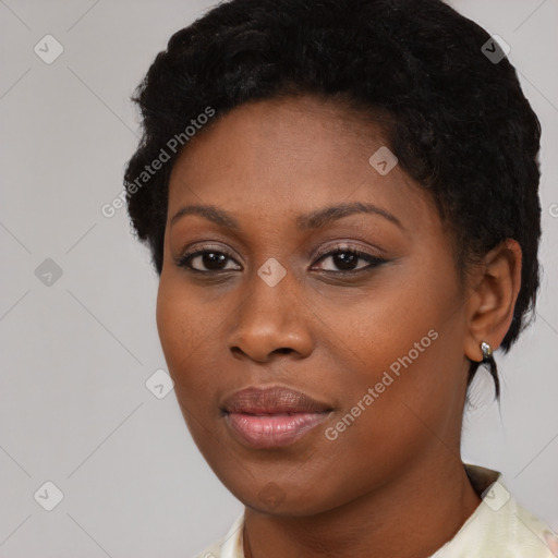 Joyful black young-adult female with short  black hair and brown eyes