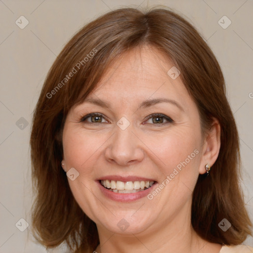 Joyful white adult female with medium  brown hair and brown eyes