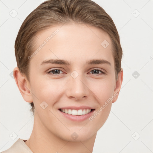 Joyful white young-adult female with short  brown hair and grey eyes