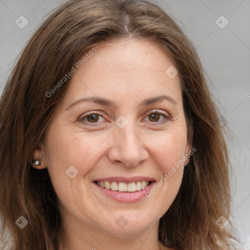 Joyful white adult female with long  brown hair and brown eyes