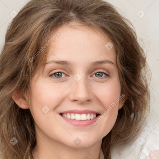 Joyful white young-adult female with medium  brown hair and green eyes