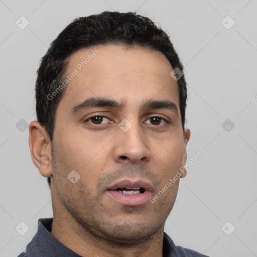 Neutral white young-adult male with short  black hair and brown eyes