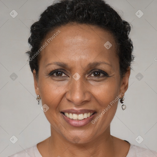 Joyful black adult female with short  brown hair and brown eyes