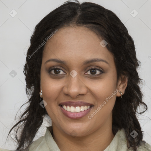 Joyful black young-adult female with long  brown hair and brown eyes